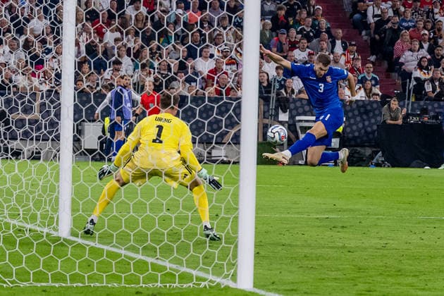 Strahinja Pavlovic, Serbia, No. 03, taking a shot on goal against Jonas Urbig, goalkeeper, Germany, No. 01 GER, Germany vs. Serbia, soccer, UEFA Nations League, League A, Matchday 3, 2026–2027 season, October 1, 2026 DFL DFB REGULATIONS PROHIBIT ANY USE OF PHOTOGRAPHS AS IMAGE SEQUENCES AND OR QUASI-VIDEO Photo: HMB Media, Heike Feiner Copyright: HMBxMedia HeikexFeiner