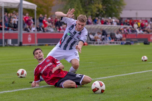 Nuremberg, Germany, October 2, 2026; Friendly Match 2026–2027: 1. FC Nürnberg vs. FC Ingolstadt 04. Pictured, from left, in a tackle: Andrea Ceresoli (FCN) and Benjamin Kanuric (FCI); Valznerweiher Sports Park, Bavaria Copyright: xFotostandx xSchäferx