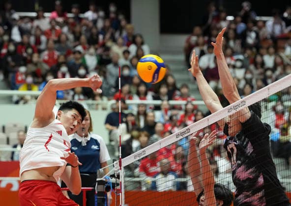 (261002) -- OKAZAKI, Oct. 2, 2026 -- Li Yongzhen (L) of China spikes the ball during the men s volleyball semifinal match between China and Japan at the 20th Asian Games Aichi-Nagoya 2026 in Okazaki of Aichi Prefecture, Japan, Oct. 2, 2026. ) (SP)JAPAN-OKAZAKI-ASIAN GAMES-VOLLEYBALL-MEN-SEMIFINAL-JPN VS CHN CheongxKamxKa 