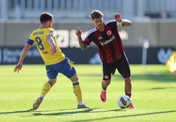 October 2, 2026, Soccer friendly match, Eintracht Frankfurt vs. Eintracht Braunschweig, from left: Mehmet Aydin (Eintracht Braunschweig), Robin Koch (Eintracht Frankfurt). DFL and DFB regulations prohibit any use of photographs as image sequences and or quasi-video. xdcx Copyright: HMBxMedia Claus