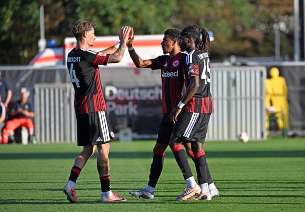 October 2, 2026, xjhx, soccer exhibition match, Eintracht Frankfurt vs. Eintracht Braunschweig; from left: Robin Koch (Eintracht Frankfurt), Ansgar Knauff (Eintracht Frankfurt), Cherif Cisse (Eintracht Frankfurt) celebrate the goal; the goal celebration after the 3-0 win in Frankfurt am Main