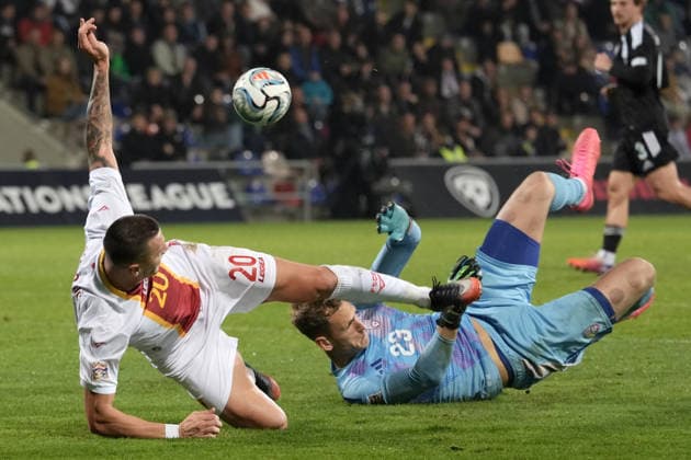 Goalkeeper Rihards Matrevics (23) of Latvia In action against Milutin Osmajic (20) of Montenegro during UEFA Nations League Group C2 football game between Latvia and Montenegro in Riga, Latvia, Fri, Oct. 2, 2026. Riga Latvia Copyright: xRomanxKoksarovx RKV09935.JPG