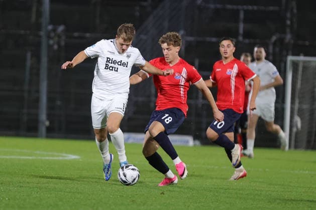 October 2, 2026, Soccer, Men s, Bavarian Regional League, 2026–2027 Season, Matchday 12: SpVgg Unterhaching vs. FC Schweinfurt 05. From left: Gil Ebner (FC Schweinfurt 05), No. 8 against Dominik Lindermeir (SpVgg Unterhaching), No. 18. Unterhaching, Uhlsport Park, Unterhaching, Bavaria, Germany