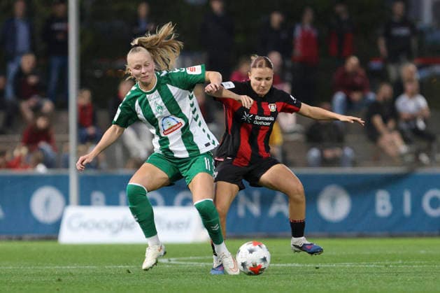 Isabella Jaron of SV Werder Bremen and Estrella Merino Gonzalez of Bayer 04 Leverkusen battle for the ball during the Women s Bundesliga match between Bayer 04 Leverkusen and SV Werder Bremen at Ulrich Haberland Stadium on October 2, 2026, in Leverkusen, Germany. Photo by Oliver Kaelke, DeFodi Images. Isabella Jaron of SV Werder Bremen and Estrella Merino Gonzalez of Bayer 04 Leverkusen battle for the ball during the Bundesliga match between Bayer 04 Leverkusen and SV Werder Bremen at Ulrich Haberland Stadium on October 2, 2026 in Leverkusen, Germany. Photo by Oliver Kaelke, DeFodi Images. DFB and DFL regulations prohibit any use of photographs as image sequences and or quasi-video. Photo by Oliver Kaelke, DeFodi Images.
