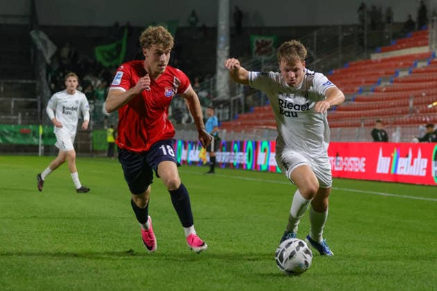 October 2, 2026, Soccer, Men s, Bavarian Regional League, 2026–2027 Season, Matchday 12: SpVgg Unterhaching vs. FC Schweinfurt 05. From left: Dominik Lindermeir (SpVgg Unterhaching, No. 18) and Gil Ebner (FC Schweinfurt 05, No. 08). Unterhaching, Uhlsport Park, Unterhaching, Bavaria, Germany