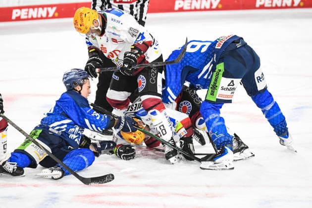 Simon Seidl and Marcel Brandt of the Straubing Tigers battle for the puck against Nicolas Jensen of the Bremerhaven Pinguins, Men s Ice Hockey, German Ice Hockey League, Penny DEL, Matchday 5, 2026–2027 season on October 2, 2026, at the Eisstadion am Pulverturm, Straubing Tigers (blue) vs. Pinguins Bremerhaven (white)