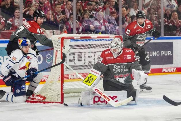 Ice Hockey: Penny DEL, Matchday 5—Cologne Sharks vs. EHC Red Bull Munich on October 2, 2026, at the Lanxess Arena in Cologne. Luis Becker (Munich), left: Veli Matti Vittasmäki (Cologne), center: Janne Juvonen (Cologne), right: In accordance with the regulations of the DEL (German Ice Hockey League), the publication and further use of the footage in electronic media and on devices of any kind during the game is not permitted. xDMx