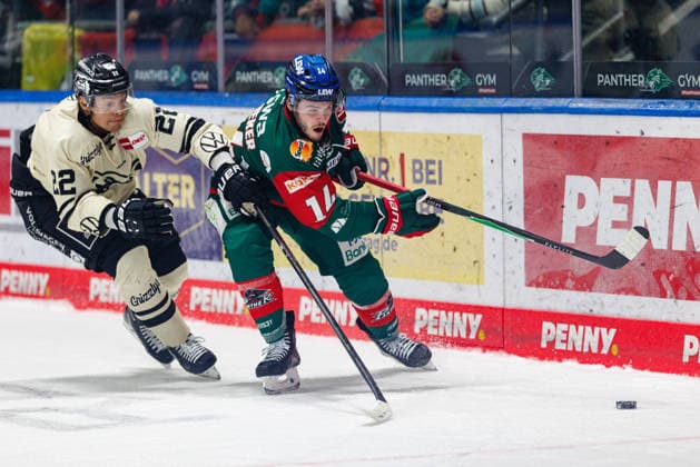 D. J. Busdeker, 14, of the Augsburger Panther, and Madison Bowey, 22, of the Grizzlys Wolfsburg, during the game between the Augsburger Panther and the Grizzlys Wolfsburg, ice hockey, men s, DEL, 2026–2027, Matchday 5 on October 2, 2026, in Augsburg, Curt Frenzel Stadium, Bavaria, Germany