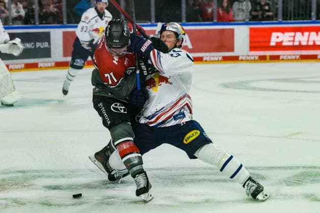 Ice Hockey: Penny DEL, Matchday 5—Cologne Sharks vs. EHC Red Bull Munich on October 2, 2026, at the Lanxess Arena in Cologne. Daniel Fischbuch, Cologne, left: Patrick Hager (Munich), right: In accordance with the regulations of the DEL (German Ice Hockey League), the publication and further use of the images in electronic media and on devices of any kind during the game is not permitted xDMx