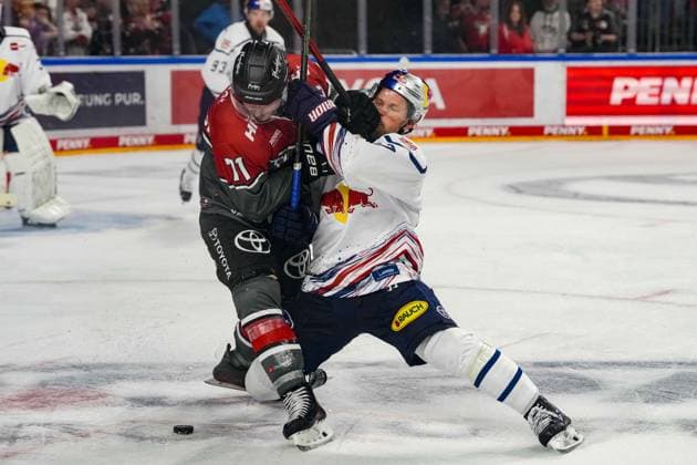 Ice Hockey: Penny DEL, Matchday 5—Cologne Sharks vs. EHC Red Bull Munich on October 2, 2026, at the Lanxess Arena in Cologne. Daniel Fischbuch, Cologne, left: Patrick Hager (Munich), right: In accordance with the regulations of the DEL (German Ice Hockey League), the publication and further use of the images in electronic media and on devices of any kind during the game is not permitted xDMx