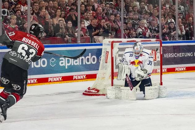Ice Hockey: Penny DEL, Matchday 5—Cologne Sharks vs. EHC Red Bull Munich on October 2, 2026, at the Lanxess Arena in Cologne. Patrick Russell of Cologne takes a shot on goal; unfortunately hits the left post. According to the regulations of the DEL (German Ice Hockey League), the publication and further use of the footage in electronic media and on devices of any kind during the game is not permitted. xDMx
