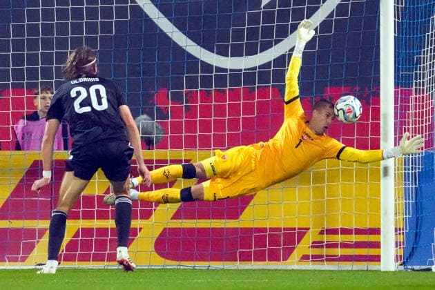October 2, 2026, Riga, Latvia: Latvian player ROBERTS ULDRIKIS tries to score (L) and goalie BALSHA POPOVICH of Montenegro tries to save during the League C match of UEFA Nations League between Latvia and Montenegro in Riga, Latvia, Oct. 2, 2026. Riga Latvia - ZUMAp305 20261002_zip_p305_006 Copyright: xEdijsxPalensx