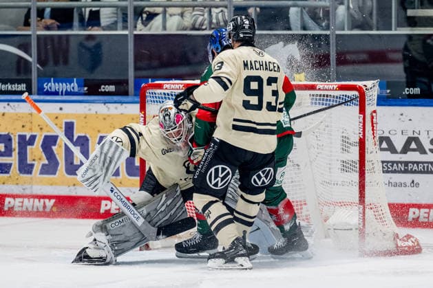 Dustin Strahlmeier, goalie, Grizzlys Wolfsburg, 01, and Spencer Machacek, Grizzlys Wolfsburg, 93, defend against Alec McCrea, Augsburger Panther, 03, GER, Augsburger Panther vs. Grizzlys Wolfsburg, ice hockey, DEL, 2026–2027 season, Matchday 4, October 2, 2026. Photo: HMB Media, Heike Feiner Copyright: HMBxMedia HeikexFeiner