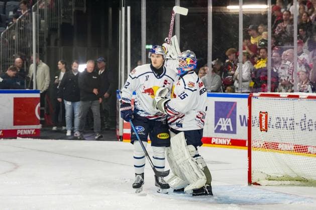 Ice Hockey: Penny DEL, Matchday 5—Cologne Sharks vs. EHC Red Bull Munich on October 2, 2026, at the Lanxess Arena in Cologne. Mathias Niederberger of Munich (right) is celebrated alongside Brady Ferguson of Munich, on the left, celebrating the 2–4 away victory. In accordance with the regulations of the DEL (German Ice Hockey League), the publication and further use of the footage in electronic media and on devices of any kind during the game is not permitted. xDMx
