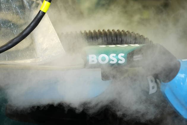 October 3, 2026, Sepang International Circuit, Kuala Lumpur, 2026 Formula 1 Gulf Air Bahrain Grand Prix, The cockpit of Fernando Alonso (ESP) of the Aston Martin Aramco Formula One Team is being cooled before practice; steam drifts across the rearview mirror featuring the BOSS sponsor logo. Photo by Hasan Bratic, DeFodi Images