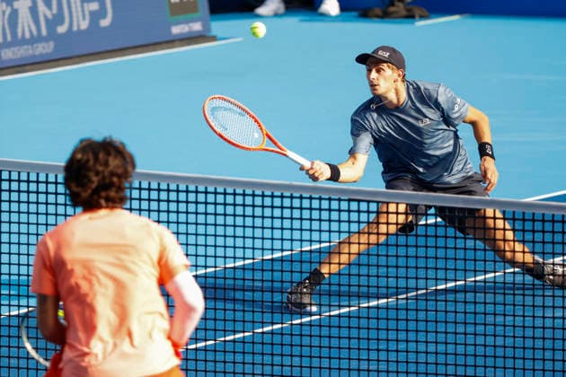 October 3, 2026, Tokyo, Japan: (From top to bottom) Matteo Arnaldi (Italy) returns a shot against Carlos Alcaraz (Spain) during their Round of 16 match at the Kinoshita Group Japan Open Tennis Championships at Ariake Colosseum in Tokyo. The tournament runs from September 29 to October 6. Alcaraz won 7-6(6), 6-1. Tokyo Japan - ZUMAm191 20261003_aap_m191_075 Copyright: xRodrigoxReyesxMarinx