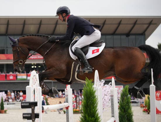 (261003) -- TOKYO, Oct. 3, 2026 -- Lam Patrick of China s Hong Kong competes during the jumping Ind B (up to 1.55m) 1st round of equestrian at the 20th Asian Games Aichi-Nagoya 2026 in Tokyo, Japan, Oct. 3, 2026. (Photo by Xinhua) (SP)JAPAN-TOKYO-ASIAN GAMES-EQUESTRIAN-JUMPING IND B WangxShen 