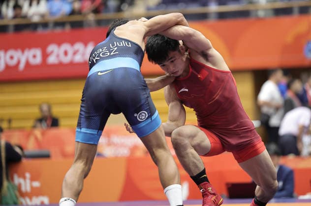 (261003) -- NAGOYA, Oct. 3, 2026 -- Zou Wanhao (R) of China competes against Bekzat Almaz Uulu of Kyrgyzstan during the men s freestyle 57kg bronze medal match of Wrestling at the 20th Asian Games Aichi-Nagoya 2026 in Nagoya, Japan, Oct. 3, 2026. ) (SP)JAPAN-NAGOYA-ASIAN GAMES-WRESTLING-MEN S FREESTYLE 57KG-BRONZE MEDAL MATCHES LongxLei 