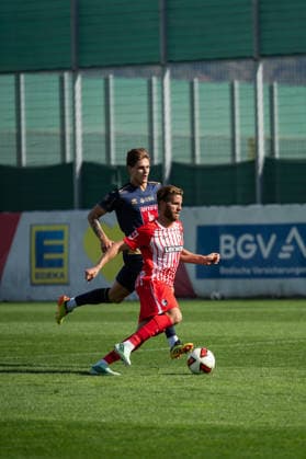 October 3, 2026, xjyhynx, soccer exhibition match, SC Freiburg vs. FC Lucerne, from left: Loïc Lüthi 21, FC Lucerne vs. Lucas Höler 9, SC Freiburg, Freiburg