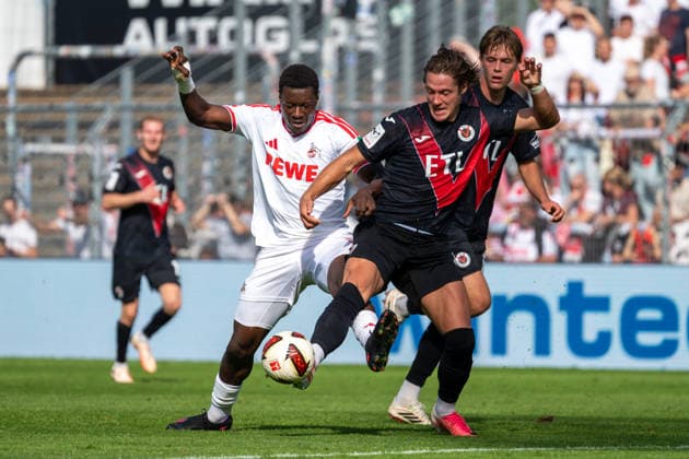 Tackle between Ragnar Ache of 1. FC Köln, 09, and Tobias Eisenhut of Viktoria Köln, 06. Also featuring Tim Kloss of Viktoria Cologne, 18. FC Viktoria Cologne vs. FC Hansa Rostock, soccer, 3rd Division, Matchday 5, 2026–2027 season, September 11, 2026 DFL DFB regulations prohibit any use of photographs as image sequences and or quasi-video FC Viktoria Cologne vs. FC Hansa Rostock, soccer, 3rd Division, Matchday 5, 2026–2027 season, September 11, 2026, Cologne Copyright: xEibner-Pressefoto ThomasxHaeslerx EP_THR