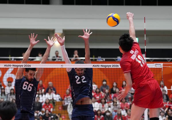 (261003) -- OKAZAKI, Oct. 3, 2026 -- Nishiyama Hiroto (R) of Japan spikes the ball during the men s volleyball final match between Japan and Iran at the 20th Asian Games Aichi-Nagoya 2026 in Okazaki of Aichi Prefecture, Japan, Oct. 3, 2026. ) (SP)JAPAN-OKAZAKI-ASIAN GAMES-VOLLEYBALL-MEN S FINAL-JPN VS IRI JiaxYuchen 