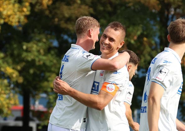 SV Gützkow vs. FC Hansa Rostock, Gützkow, October 3, 2026, Soccer, MV State Cup SV Gützkow FC Hansa Rostock 0–1 Emil Holten of FC Hansa Rostock celebrates his goal with Franz Pfanne of FC Hansa Rostock at the Friedrich Ludwig Jahn Stadium in Gützkow, Mecklenburg-Western Pomerania, Germany