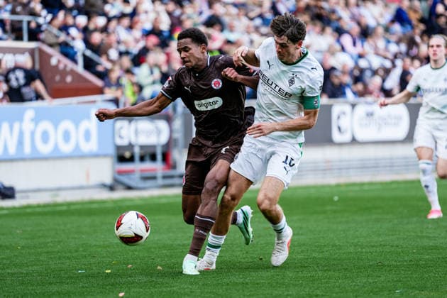 Germany Soccer: 2. Bundesliga, Bundesliga, Friendly Match, 2026–27 Season, FC St. Pauli vs. Borussia Mönchengladbach, Millerntor Stadium, Hamburg, St. Pauli, Youssoupha Niang (FC St. Pauli), 7, tackle, Philipp Sander (Borussia Mönchengladbach), 16 Copyright: xStefanxTrochax