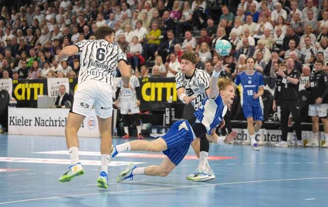 Photo: Ellidi Snaer Vidarsson (Gummersbach) shoots against Rasmus Ankermann (Kiel) and Harald Reinkind (Kiel) on the left. Men s Handball 1st Bundesliga on Sat, Oct 3, 2026: THW Kiel vs. VfL Gummersbach