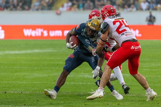 Tofunmi Lala (Dresden Monarchs, 08 Running Back) tackled by Ryan Minniti (Potsdam Royals, 24 Linebacker) and Devin Hembry (Potsdam Royals, 06 Defensive Back) Dresden Monarchs vs Potsdam Royals, American Football, German Football League, Week 22, Championship Game, 2026, 03.10.2026, Dresden Rudolf Harbig Stadion Saxony Germany Copyright: xPFA SebastianxJustx