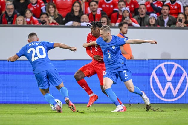 Aljosa Matko of Slovenia, Johan Manzambi of Switzerland, and Zan Karnicnik of Slovenia battle for the ball during the UEFA Nations League 2026–27 group stage match between Switzerland and Slovenia at Luzern Arena on October 3, 2026, in Lucerne, Switzerland. Photo by Harry Langer, DeFodi Images