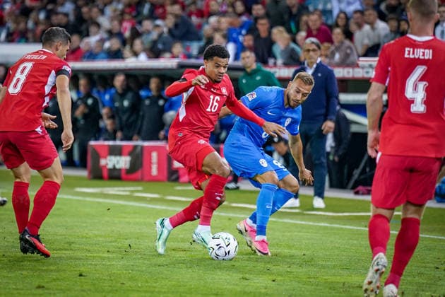 Soccer: UEFA Nations League 2026–2027, Matchday 3: Switzerland vs. Slovenia at Thermoplan Arena Lucerne—Zachary Athekame (Switzerland, No. 16) and Sandi Lovric (Slovenia, No. 8) in a tackle Copyright: xJOERANxSTEINSIEKx
