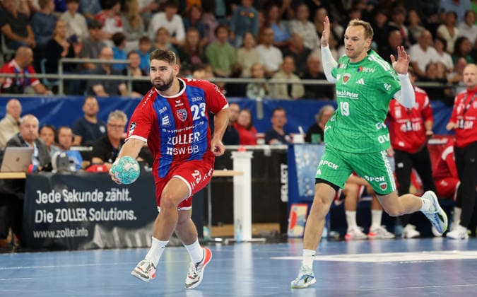 October 3, 2026, Germany, Bietigheim: Handball SG BBM Bietigheim vs. Berliner Füchse; from left: Marcus Norrbrink (BBM), Mathias Gidsel (Berlin)