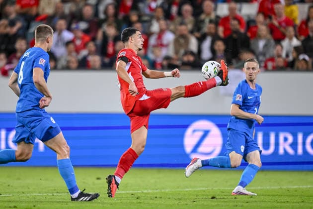 Jaka Bijol of Slovenia, Zeki Amdouni of Switzerland, and Zan Karnicnik of Slovenia battle for the ball during the UEFA Nations League 2026–27 group stage match between Switzerland and Slovenia at Luzern Arena on October 3, 2026, in Lucerne, Switzerland. Photo by Harry Langer, DeFodi Images