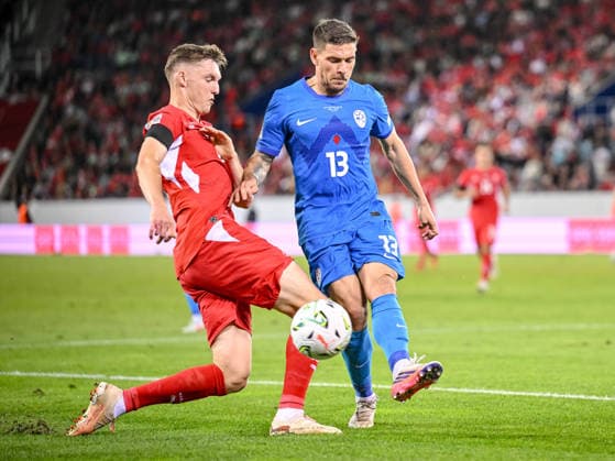 Michel Aebischer of Switzerland and Erik Janza of Slovenia battle for the ball during the UEFA Nations League 2026–27 group stage match between Switzerland and Slovenia at Luzern Arena on October 3, 2026, in Lucerne, Switzerland. Photo by Harry Langer, DeFodi Images