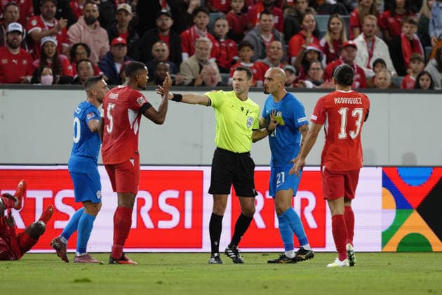 Luzern, Switzerland - October 03: Vanja Drkusic (21 SLO) is attacking Manuel Akanji (5 SUI) Referee Ivan Kruzliak in between during the UEFA Nations League match between Switzerland and Slovenia at thermoplan arena on October 03, 2026 in Luzern, Switzerland. Copyright: xKjetilxWaberx xSPPx Sportspressphoto_SPR244740