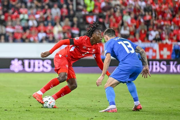 Johan Manzambi of Switzerland and Erik Janza of Slovenia battle for the ball during the UEFA Nations League 2026–27 group stage match between Switzerland and Slovenia at Luzern Arena on October 3, 2026, in Lucerne, Switzerland. Photo by Harry Langer, DeFodi Images