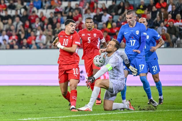 Zeki Amdouni of Switzerland and goalkeeper Jan Oblak of Slovenia battle for the ball during the UEFA Nations League 2026–27 group stage match between Switzerland and Slovenia at Luzern Arena on October 3, 2026, in Lucerne, Switzerland. Photo by Harry Langer, DeFodi Images