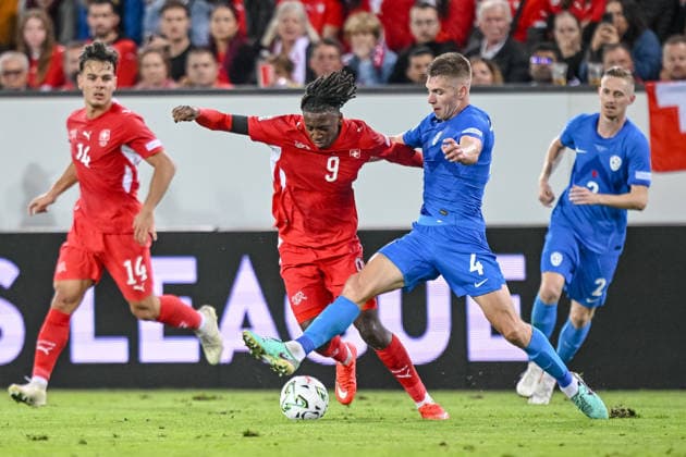 Johan Manzambi of Switzerland and Zan Celar of Slovenia battle for the ball during the UEFA Nations League 2026–27 group stage match between Switzerland and Slovenia at Luzern Arena on October 3, 2026, in Lucerne, Switzerland. Photo by Harry Langer, DeFodi Images