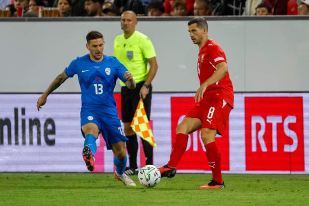 Erik Janza of Slovenia, 13, and Remo Freuler of Switzerland, 08, battling for the ball; Switzerland, UEFA Nations League, Matchday 3, Switzerland vs. Slovenia, October 3, 2026, Swissporarena, Lucerne, Switzerland Copyright: xGrantxHubbsx