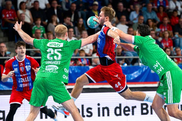 Bietigheim HBL 26 27 SG BBM Bietigheim Fuechse Berlin (from left) Matthes Langhoff (Berlin), Mathias Larson (Bietigheim), Frederik Simak (Berlin) Bietigheim Bissingen Egetrans Arena Baden-Württemberg, Germany
