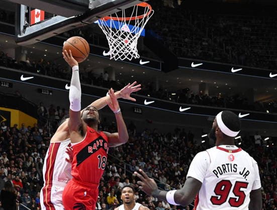 October 3, 2026, Quebec, On, Canada: Toronto Raptors Malachi Smith shoots while Miami Heat s Simone Fontecchio, back left, defends and Bobby Portis Jr. looks on during NBA, Basketball Herren, USA preseason basketball action in Quebec City, Saturday, Oct. 3, 2026. Canada News - October 3, 2026 - ZUMAc35_ 20261003_zaf_c35_123 Copyright: xJacquesxBoissinotx