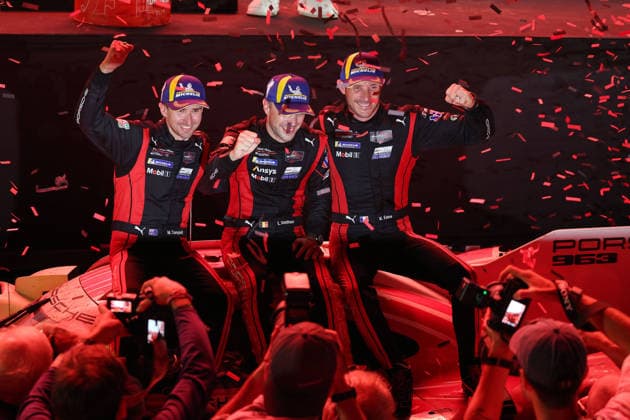 Race winners Matt Campbell (AUS), Laurens Vanthoor (BEL), and Kevin Estre (FRA) sit in the Porsche 963 at the 6th-place podium ceremony, IMSA Racing Series, 29th Motul Petit Le Mans race, Road Atlanta, Georgia, USA, October 3, 2026, 10-hour race