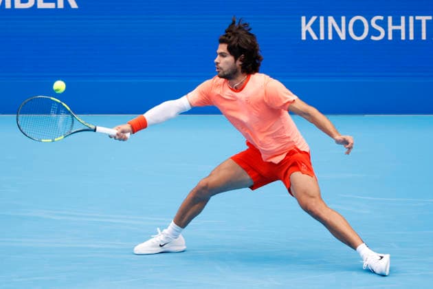 October 4, 2026, Tokyo, Japan: Carlos Alcaraz (Spain) returns a shot against Denis Shapovalov (Canada) during their quarterfinal match at the Kinoshita Group Japan Open Tennis Championships at Ariake Colosseum in Tokyo. Shapovalov suffered an injury, forcing him to retire early in the second set. The tournament runs from September 29 to October 6. Alcaraz won 7-6(3), 2-1 Tokyo Japan - ZUMAm191 20261004_aap_m191_052 Copyright: xRodrigoxReyesxMarinx