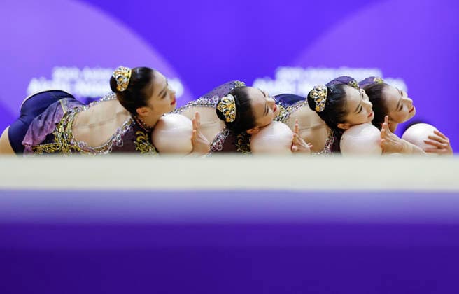 (261004) -- BEIJING, Oct. 4, 2026 -- Players of team China compete during the Group All-Around of Rhythmic gymnastics, Rhythmische Sportgymnastik, RSG at 20th Asian Games Aichi-Nagoya 2026 in Nagoya, Japan, Oct. 3, 2026. ) XINHUA PHOTOS OF THE DAY WuxZhizun 