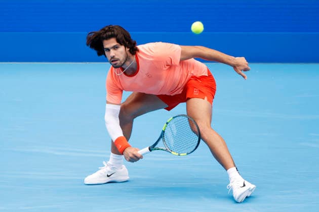 October 4, 2026, Tokyo, Japan: Carlos Alcaraz (Spain) returns a shot against Denis Shapovalov (Canada) during their quarterfinal match at the Kinoshita Group Japan Open Tennis Championships at Ariake Colosseum in Tokyo. Shapovalov suffered an injury, forcing him to retire early in the second set. The tournament runs from September 29 to October 6. Alcaraz won 7-6(3), 2-1 Tokyo Japan - ZUMAm191 20261004_aap_m191_048 Copyright: xRodrigoxReyesxMarinx