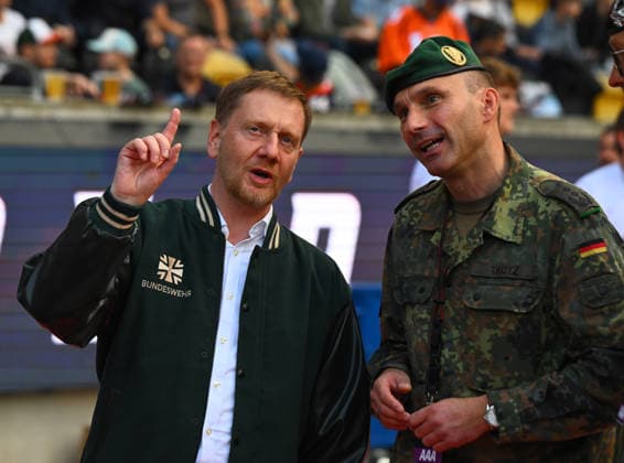 From left: Saxony’s Minister President Michael Kretschmer, Colonel Marco Tkotz, Commander of the Saxony Regional Command, Bundeswehr, Army, GFL Bowl, Bowl, German Championship final between the Dresden Monarchs and the Potsdam Royals, Final, American football, German Football League, GFL, Dresden, Rudolf Harbig Stadium, Dresden, October 3, 2026,