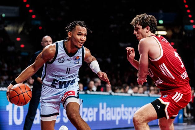 easyCredit Basketball Bundesliga FC Bayern Munich vs. EWE Baskets Oldenburg, October 4, 2026; Nicholas Tischler of EWE Baskets Oldenburg, 11, with the ball against Justinian Jessup of FC Bayern Munich, 10; easyCredit Basketball Bundesliga FC Bayern Munich vs. EWE Baskets Oldenburg, Munich, BMW Park on October 4, 2026 Copyright: xBEAUTIFULxSPORTS Wunderlx