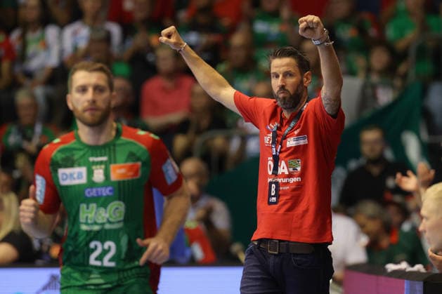 October 4, 2026, xtgx, Opel HBL Handball, SC Magdeburg vs. HC Erlangen emspor, from left: Bennet Wiegert (Magdeburg), coach celebrating, Goal celebration, celebrating the goal, celebration in a red polo shirt, after having worn his usual black one in the first half, Magdeburg