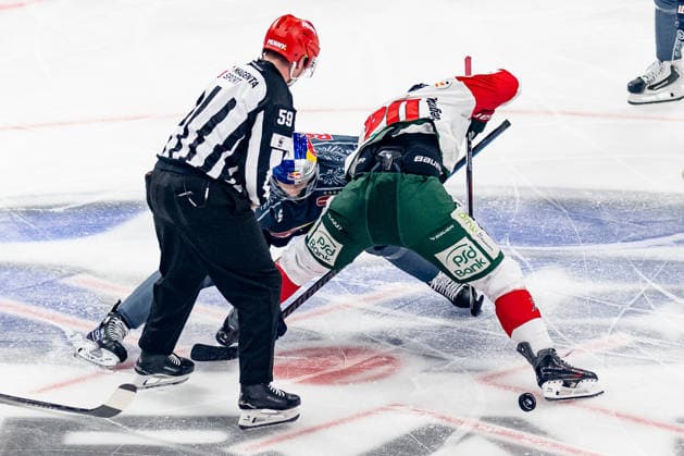 Linesman Jonas Reinold officiates a faceoff between Lucas Thaler of EHC Red Bull Munich, 48, and Philipp Krauss of the Augsburger Panther, 20 (GER), EHC Red Bull Munich vs. Augsburger Panther, DEL, 2026–2027 season, Matchday 6, October 4, 2026. Photo: HMB Media, Franz Feiner Copyright: HMBxMedia FranzxFeiner