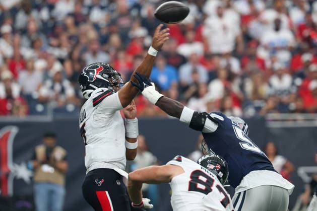 HOUSTON, TX - OCTOBER 04: Quarterback C.J. Stroud 7 of the Houston Texans passes the ball as linebacker Malachi Lawrence 57 of the Dallas Cowboys gets a hand on his throwing arm during the NFL, American Football Herren, USA football game between the Houston Texans and Dallas Cowboys on October 4, 2026, at Reliant Stadium in Houston, TX. (Photo by David Buono Icon Sportswire) NFL: OCT 04 Cowboys at Texans EDITORIAL USE ONLY Icon241004020